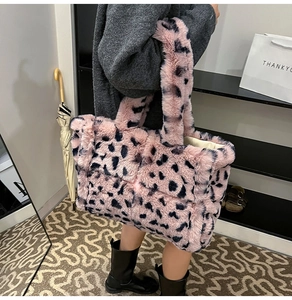 Detail of pink leopard faux fur tote showing quilted texture and soft plush shoulder strap
