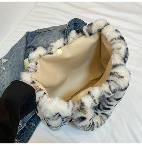 Internal view of tiger stripe plush tote bag with magnetic closure and spacious compartment