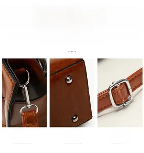 Detail of detachable hooks, protective base rivets, and adjustable strap buckle on tote