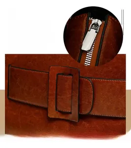 Detail of retro brown tote bag showing smooth zipper and neat stitching details