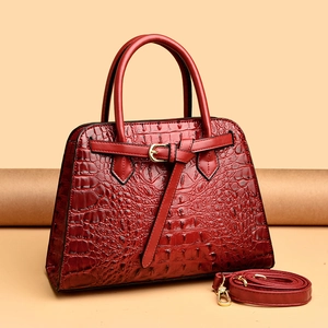 Elegant red crocodile texture handbag with gold hardware and detachable shoulder strap