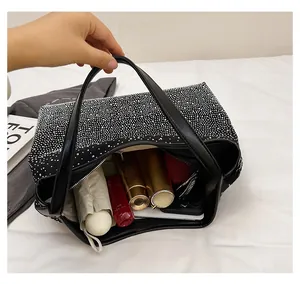Internal view of a shiny rhinestone tote bag showing large capacity for daily items