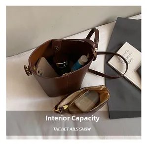 Interior view showing large capacity of the brown lychee pattern bucket bag