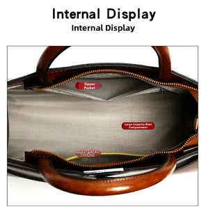 Internal view of dark brown tote bag showing main compartment and zipper pockets