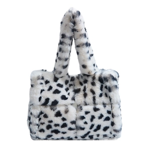 Minimalist black and white spotted plush shoulder bag with fluffy faux fur texture
