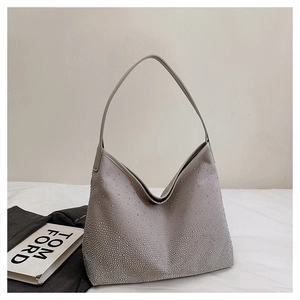 Close-up of sparkling grey rhinestone hobo bag with integrated shoulder strap and curved top
