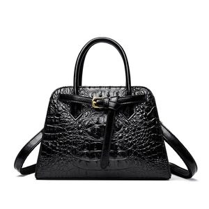 Classic black crocodile pattern handbag with golden hardware buckle and top handle