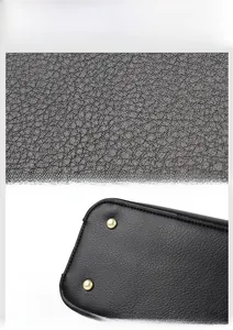 Detail showing high-quality black litchi grain leather texture and gold protective bottom studs
