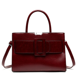 Retro burgundy leather tote bag with elegant silver buckle and stylish rounded handles
