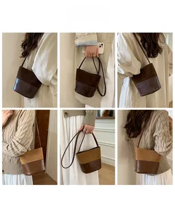 Vista dettagliata della borsa a secchiello vintage con design patchwork in pelle