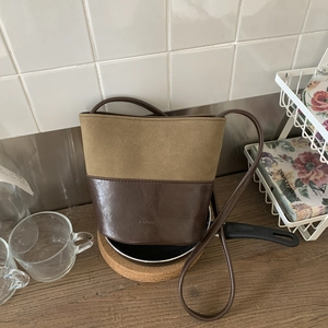 Vintage suede bucket bag in two-tone brown leather with NO FILTER debossed detail