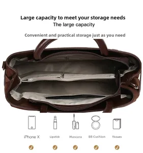 Detailed interior of brown suede tote bag featuring organized zip compartments and chevron lining