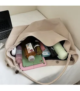 Top view of spacious beige canvas tote bag interior showing large storage capacity