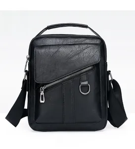 Front detail of black leather business messenger bag with diagonal zipper and D-ring