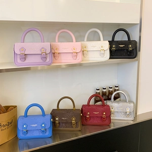 Detailed display of mini snakeskin pattern handbags in eight assorted vibrant colors