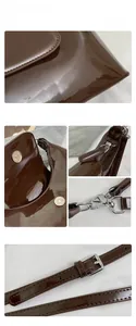 Detail view of coffee brown patent leather handbag with silver hardware and zipper