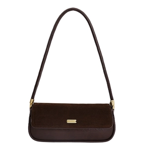 Minimalist brown suede and leather underarm bag with gold metal plaque and long strap