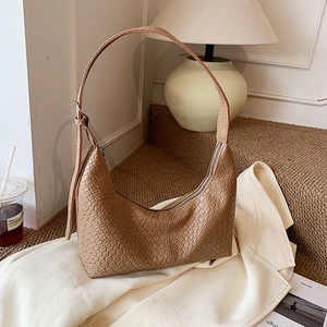 Vintage woven texture crescent crossbody bag in tan brown with adjustable shoulder strap