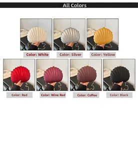 Detail of shell-shaped acrylic evening bags in multiple colors with gold chain straps