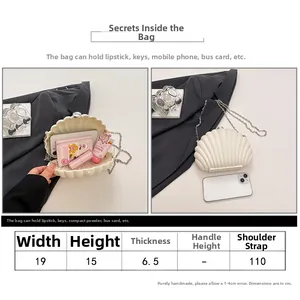 Size chart and capacity detail of white shell-shaped acrylic evening clutch bag