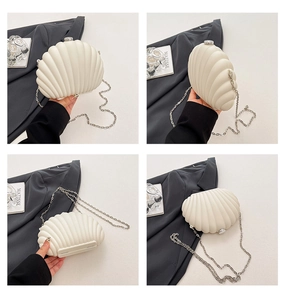 Detailed views of a shell-shaped acrylic clutch with silver chain and matte finish