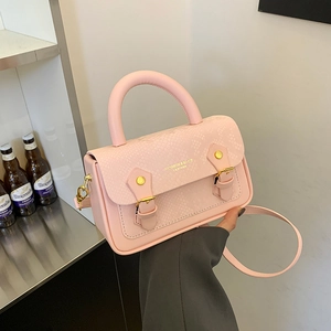 Pink faux leather handbag with snakeskin pattern and adjustable strap for women