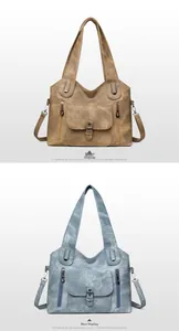Detail view of vintage soft leather tote bags with zipper pockets and detachable straps