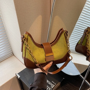 Retro crescent faux suede shoulder bag in olive green with brown leather trim and gold chain