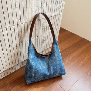 Vintage blue denim hobo tote bag with silver rhinestones and brown leather straps
