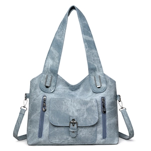 Detail of gray-blue retro tote bag with dual zippers and vintage buckle pocket