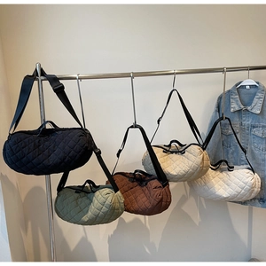 Quilted dumpling bags in black, green, brown, beige and white with wide shoulder straps