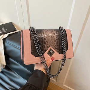 Pink patchwork crossbody bag with snakeskin pattern and gunmetal chain strap