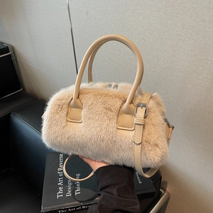 Chic beige faux fur Boston pillow bag with PU leather straps and silver metal hardware