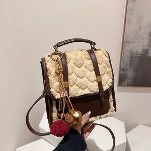 Vintage heart-patterned plush patchwork backpack with stylish tassel details for women