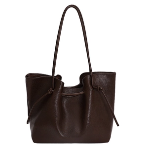 Minimalist large brown tote bag in premium faux leather with adjustable knotted drawstring