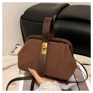 Brown matte shell handbag featuring vintage doctor bag silhouette and golden metal clasp