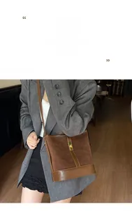 Detail of coffee brown bucket bag showing suede and glossy leather texture with clasp
