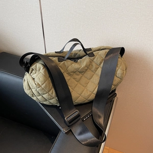 Olive green quilted bowling bag with wide adjustable strap and nylon handles