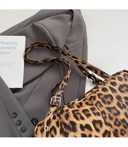 Detail of leopard print bag showing high-quality adjustable strap with silver buckle