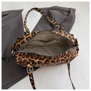 Interior view of leopard print bowling bag showing zipper pocket and adjustable strap