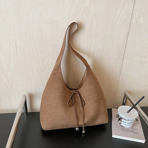 Brown suede hobo bag with drawstring bow and metal charms for women's daily commute
