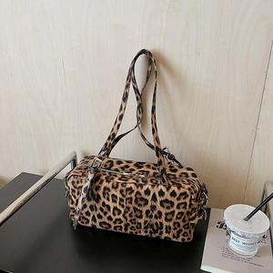 Leopard print bowling bag with double top handles and adjustable shoulder strap