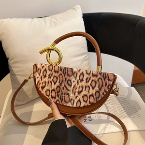 Stylish leopard print leather handbag with golden round handle and detachable strap