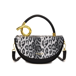 Fashion silver leopard print handbag with golden twist handle and black leather details