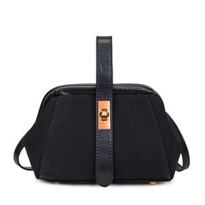 Retro black matte shell handbag with suede texture and bronze twist lock closure