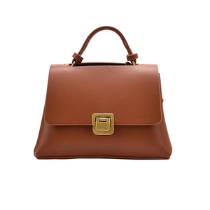 Vintage brown leather handbag with gold buckle and top handle in a minimalist style