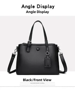Vue de face du sac cabas en cuir noir avec ferrures argentées et poignées doubles