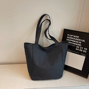 Minimalist black and white checkered canvas tote bag with long shoulder straps for daily use