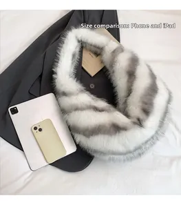 Close-up of fluffy striped faux fur scarf size comparison with a phone and tablet