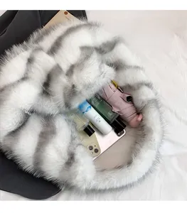Faux fur tote bag detail showing large capacity with phone, perfume and umbrella inside